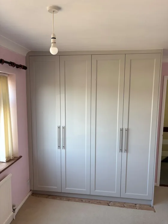 Fitted four door wardrobe with five part shaker doors in Manningtree, sprayed in a soft grey finish