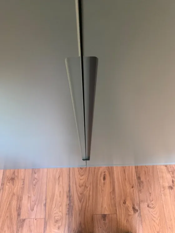 Detail of the shaped opening edge on a handleless wardrobe door in Manningtree