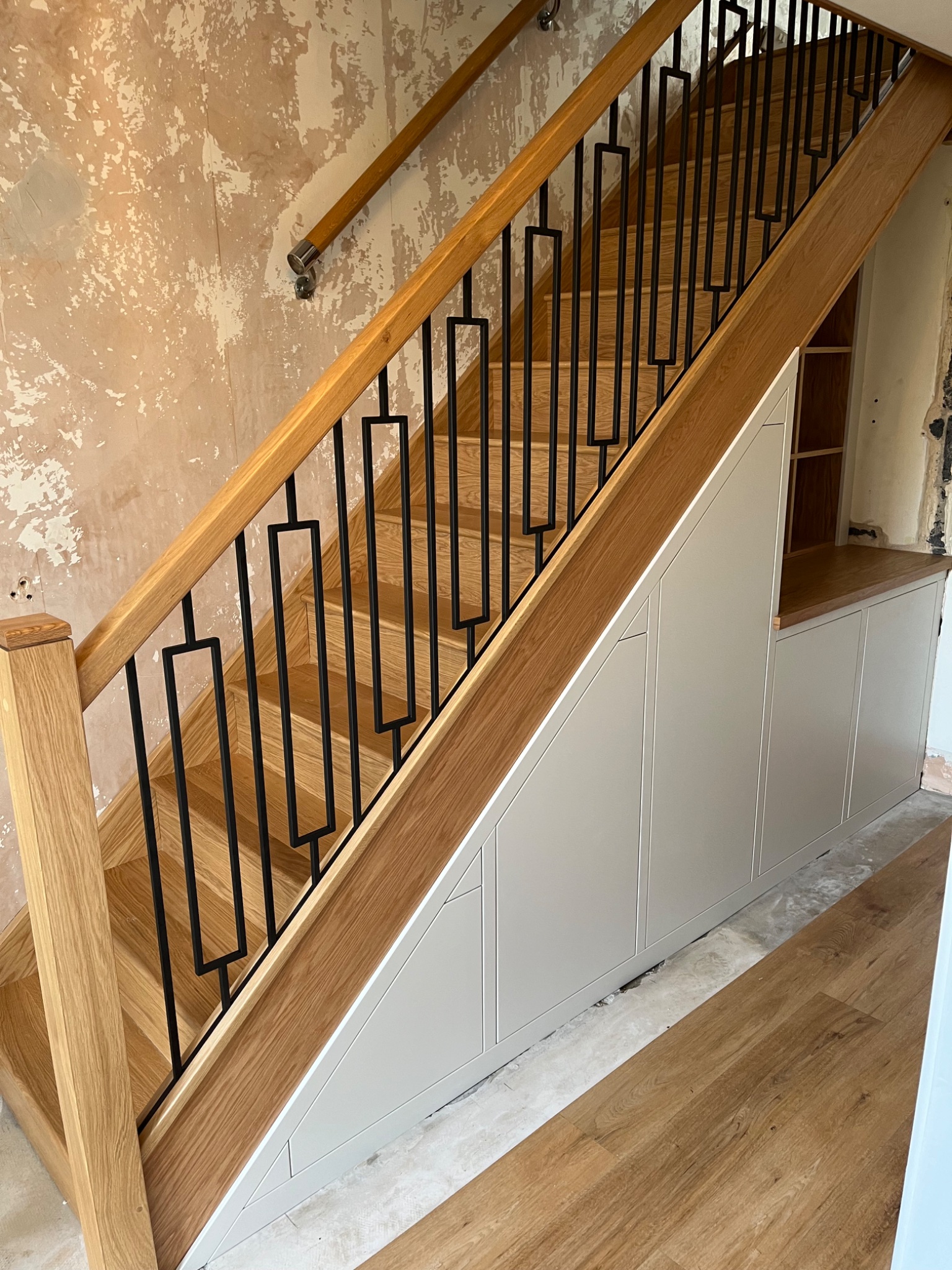 Solid oak staircase with made to measure under stairs cupboards in a Harwich home