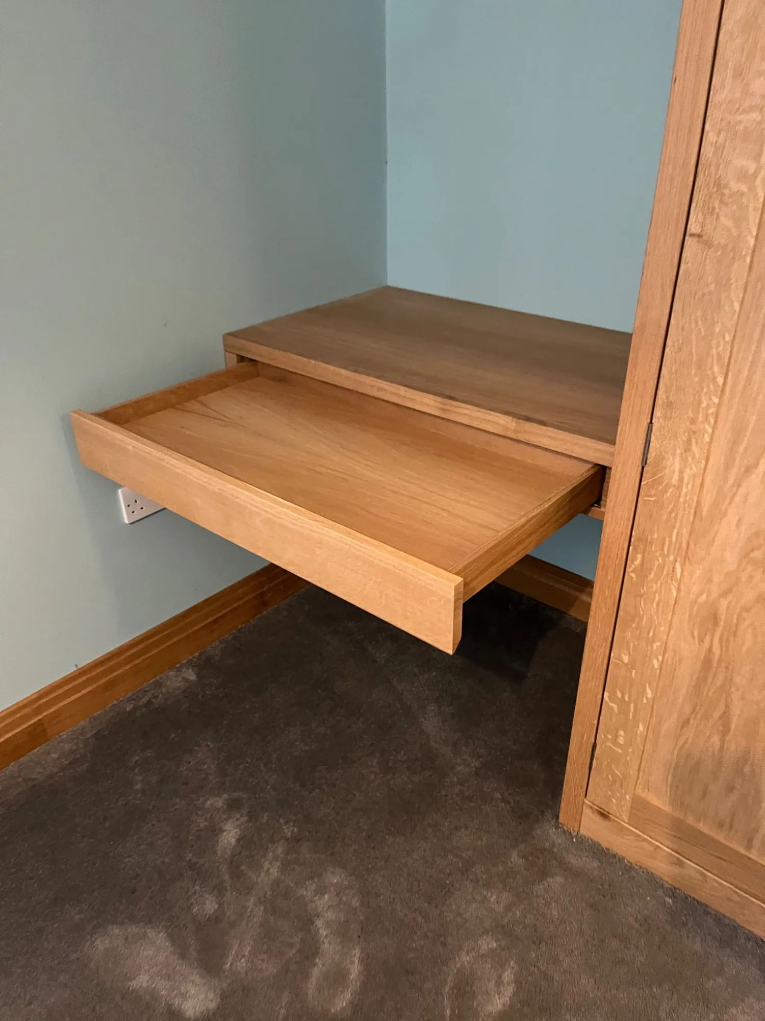 Solid oak drawer open on the made-to-measure wardrobe in Dedham