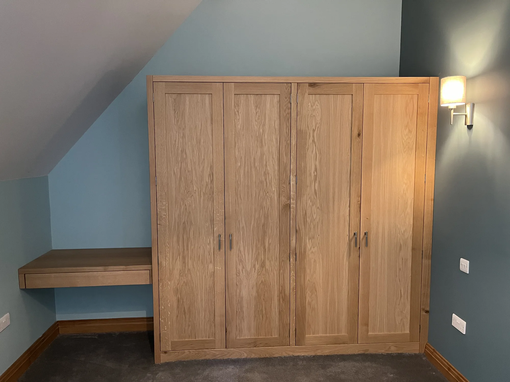 Handmade dressing room with pull-out shoe storage and hanging rails