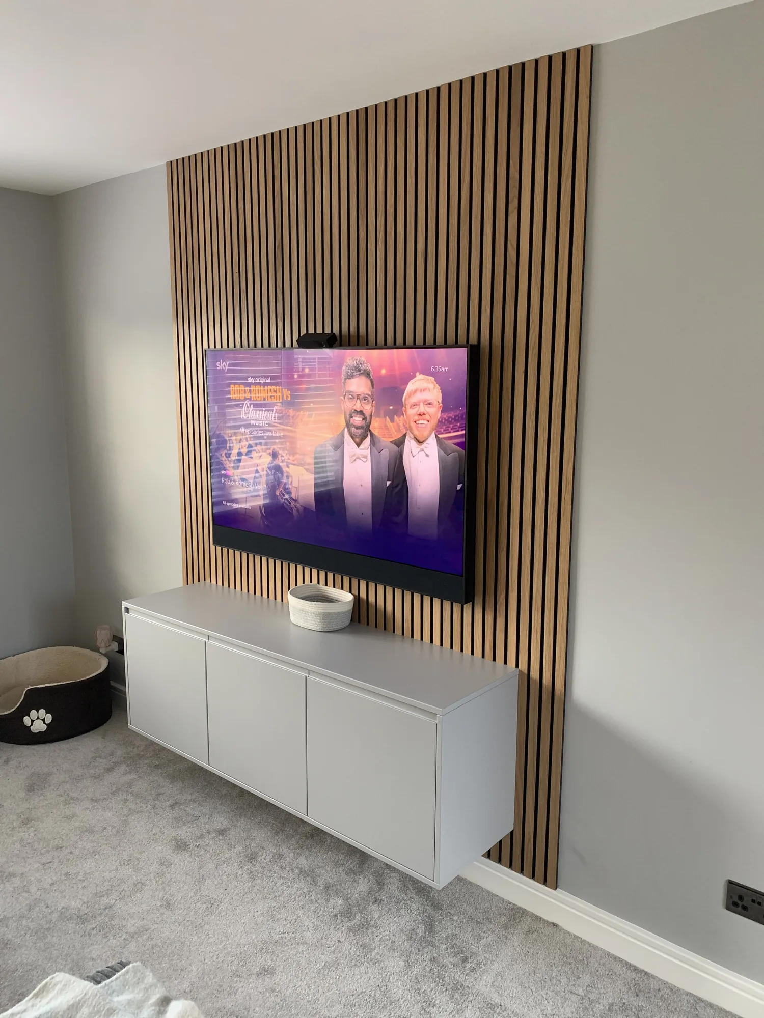 Bespoke walk-in dressing room with drawer banks and full-length hanging