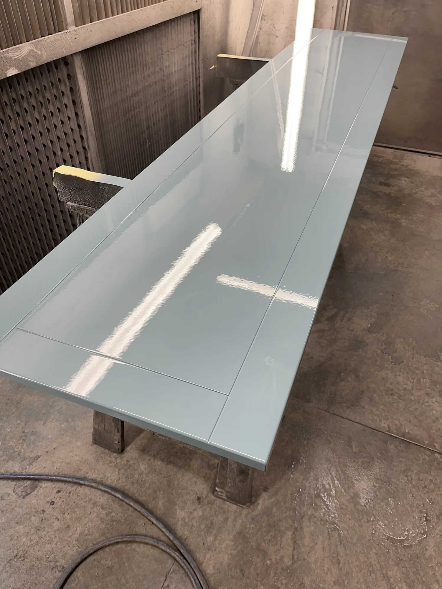 Kitchen doors after final spray, showing an even, durable PU finish